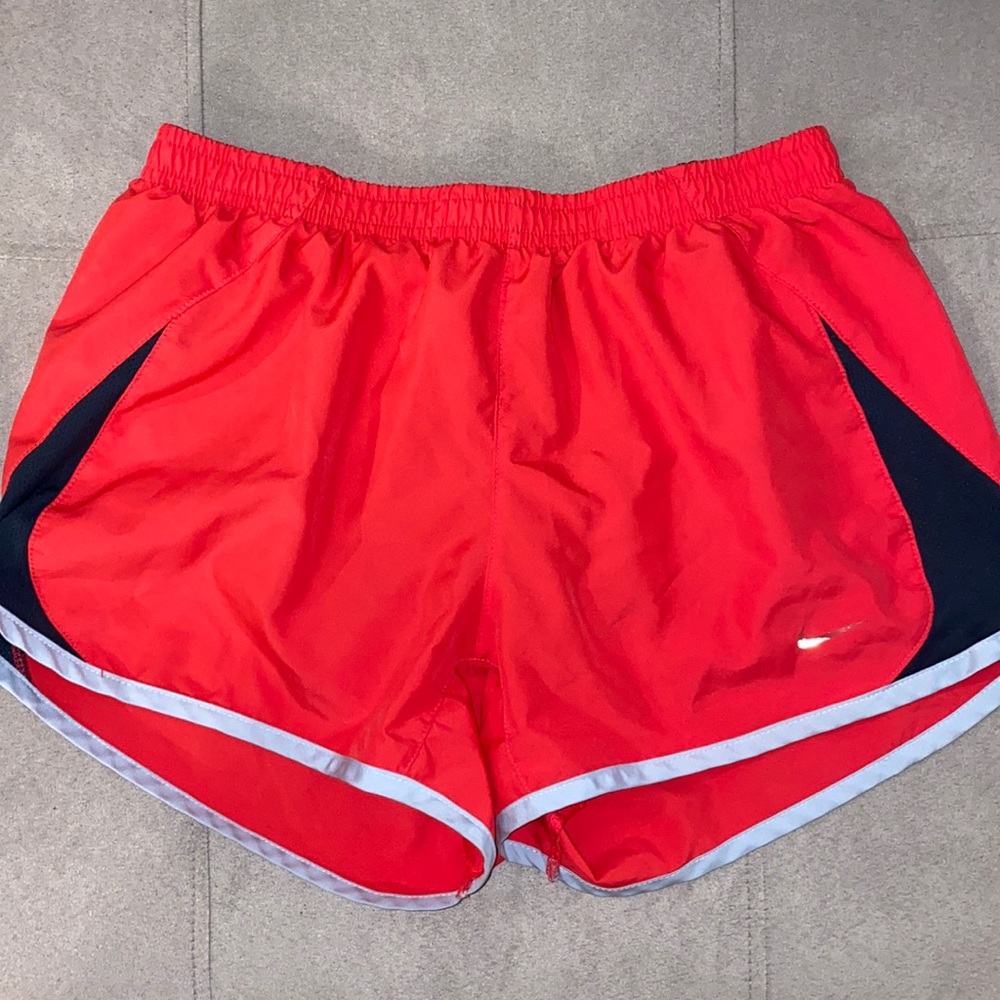Red Nike dri-fit athletic shorts